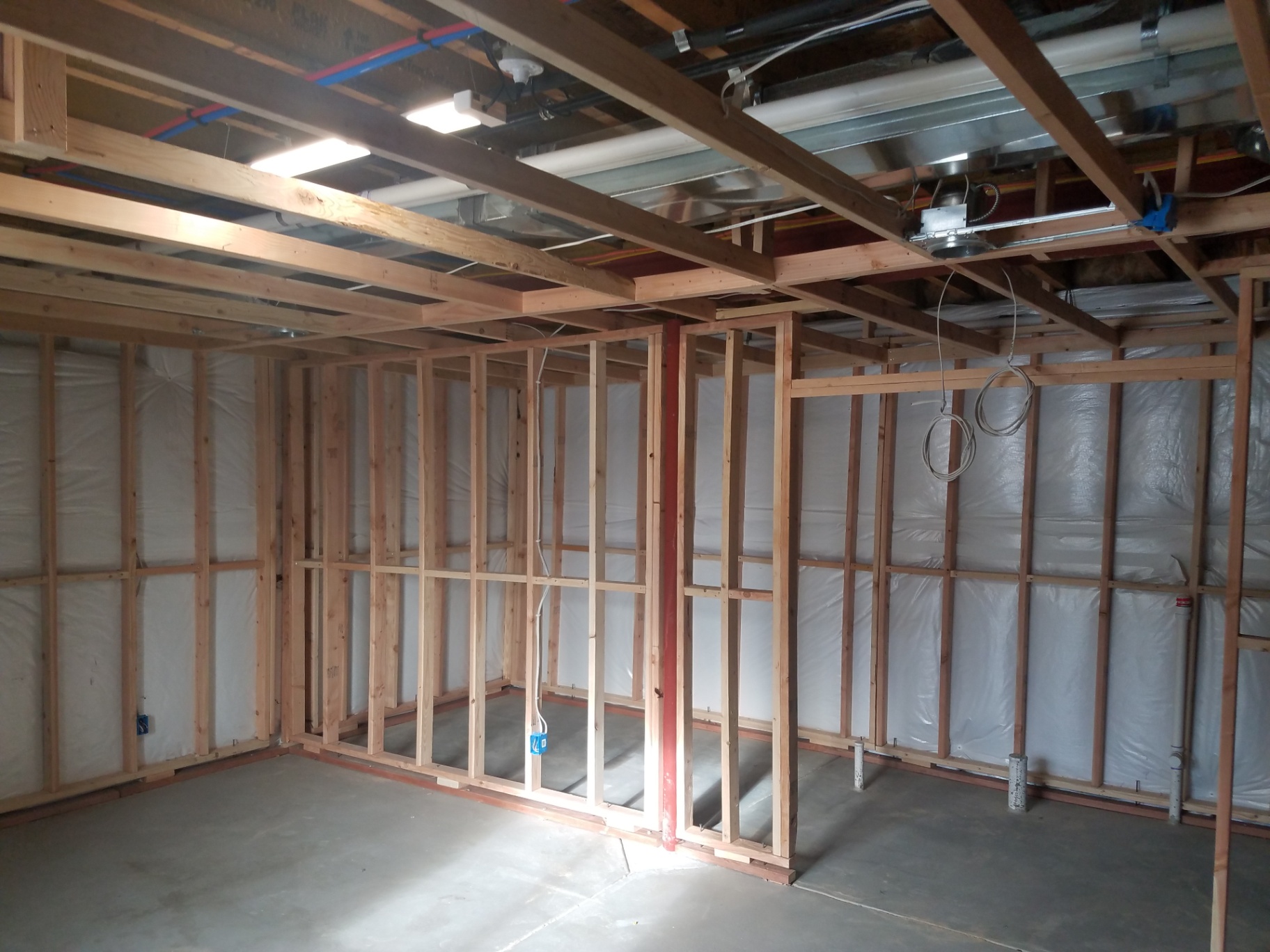 Basement framing with ceiling joists and insulated exterior walls